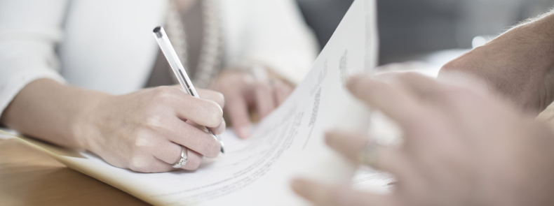 Woman signing documents